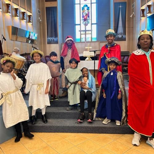 Sunday School students wearing their Christmas nativity play costumes